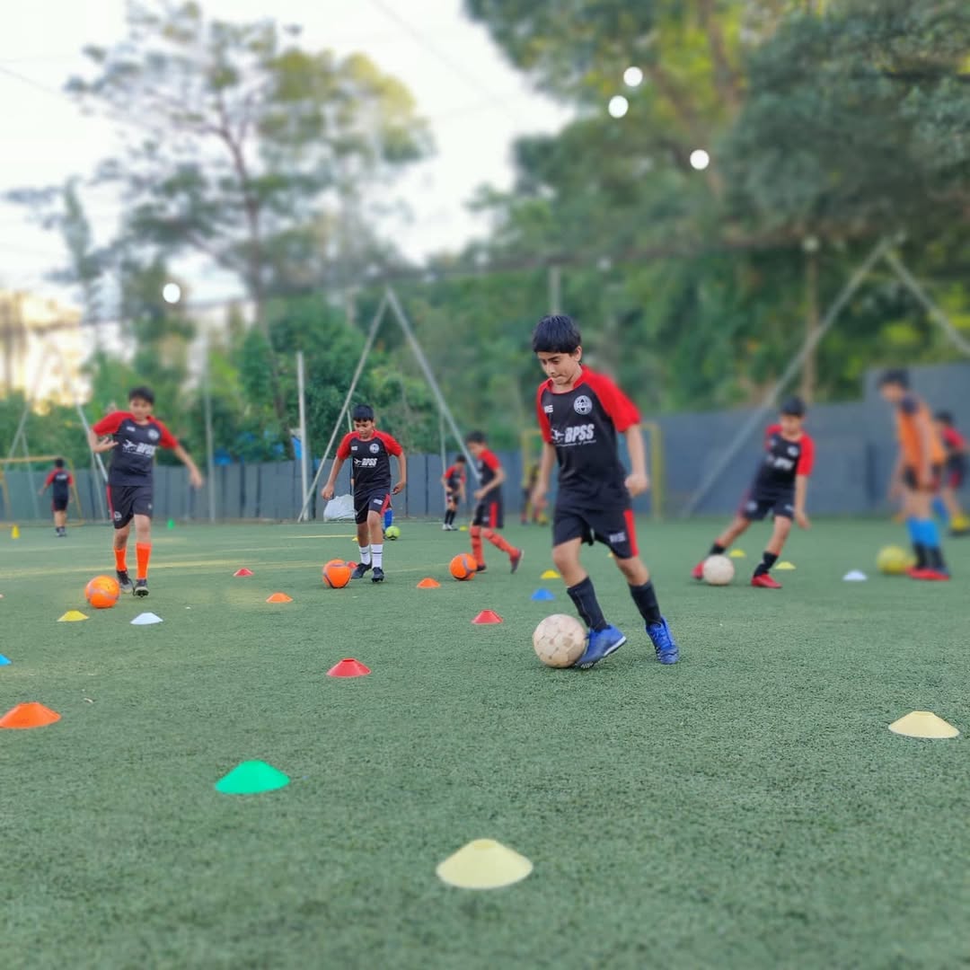 BPSS goalkeeper making a diving save during a competitive TCL league match