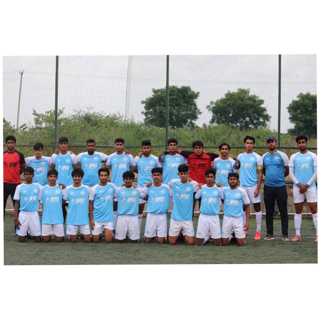 Large group photo of BPSS Summer Football Program participants of all age groups on the pitch