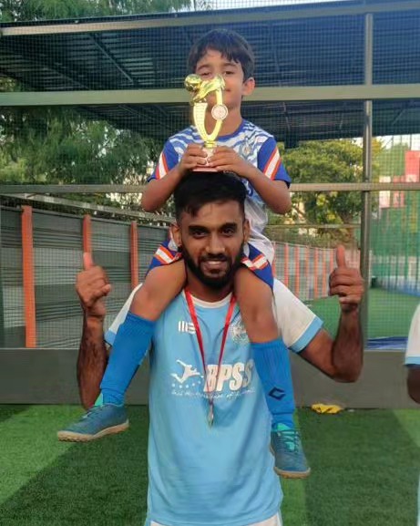 BPSS U-10 Junior Strikers proudly holding the Bronze Cup trophy after their TCL victory